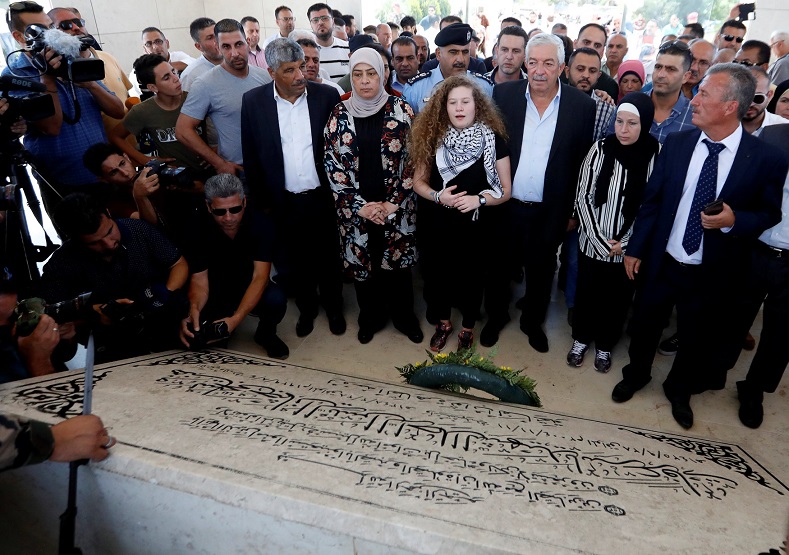 Freed Palestinian teenager Ahed Tamimi visits the tomb of late Palestinian President Yasser Arafat after she was released from an Israeli prison, in Ramallah in the occupied West Bank July 29, 2018.