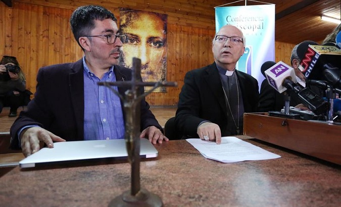 The deputy bishop of Santiago's archdiocese, Fernando Ramos (R), and the spokesperson of the Episcopal Conference of Chile, Jaime Coiro (L), in Chile, August 3, 2018.