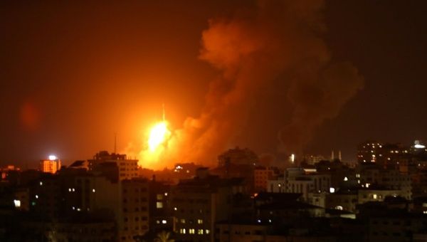 An explosion from an Israeli air strike in Gaza City on August 8, 2018. 