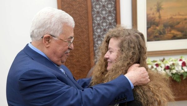 Palestinian President Mahmoud Abbas meets with freed Palestinian teenager Ahed Tamimi after she was released from an Israeli prison, in Ramallah in the occupied West Bank July 29, 2018.