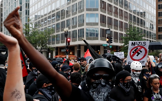 Antifascists, opponents of a white nationalist-led rally 'Unite the Right 2' rally, gather in downtown Washington, U.S., August 12, 2018