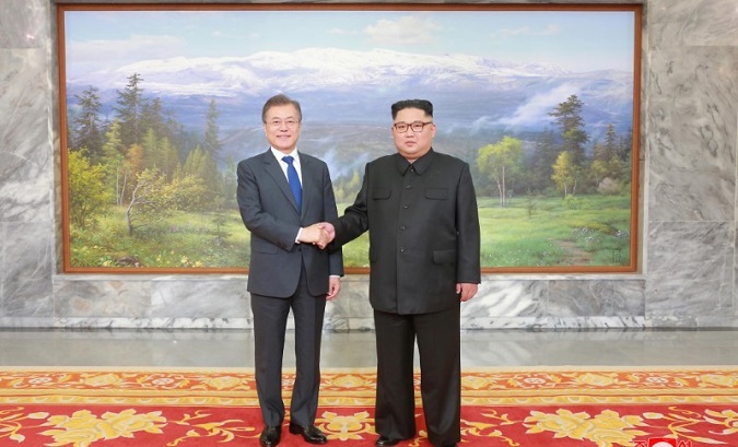 South Korean President Moon Jae-in shakes hands with North Korean leader Kim Jong Un during their summit at the truce village of Panmunjom. May 2018