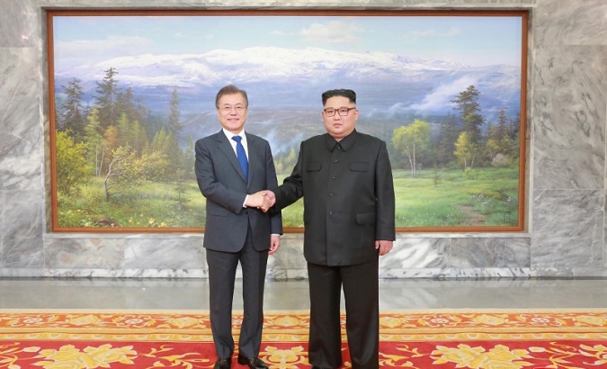 South Korean President Moon Jae-in shakes hands with North Korean leader Kim Jong Un during their summit at the truce village of Panmunjom, North Korea, on May 27, 2018.