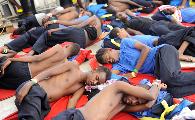 Migrants stranded at sea rest on board the Aquarius rescue ship run by SOS Mediterranee organisation and Doctors Without Borders during a search and rescue operation in the Mediterranean Sea, off the Libyan Coast, August 12, 2018.