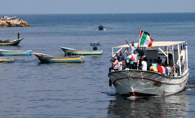 Palestinians ride a boat as they take part in a rally to show solidarity with Gaza-bound flotilla Oct. 5, 2016..