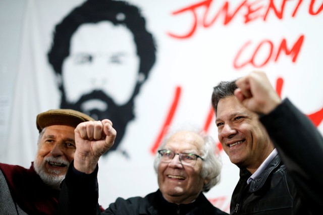 Argentine Nobel Peace Laureate Esquivel, center, Brazil's former Foreign Minister Amorim, right, and Former Sao Paulo Mayor Haddad gesture after visiting Brazil's former President Luiz Inacio Lula da Silva at the Federal Police headquarters in Curitiba.