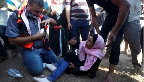 Medics said Israeli gunfire killed two men and wounded at least 270 other Palestinians, 40 of them with live bullets.