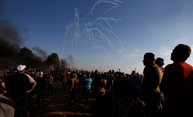 Israeli troops fire tear gas at Palestinian demonstrators demanding the right to return to their homeland in Gaza, August 17, 2018.