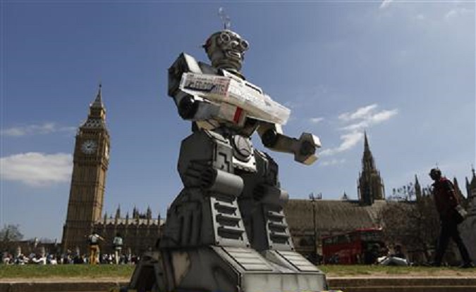 A robot is pictured in front of the Houses of Parliament and Westminster Abbey as part of the Campaign to Stop Killer Robots in London April 23, 2013.