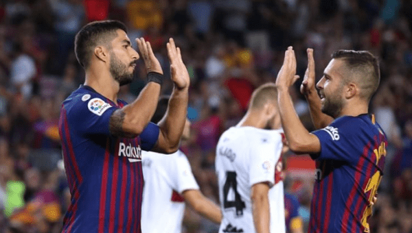 Barcelona's Luis Suarez celebrates scoring their eighth goal with Jordi Alba 