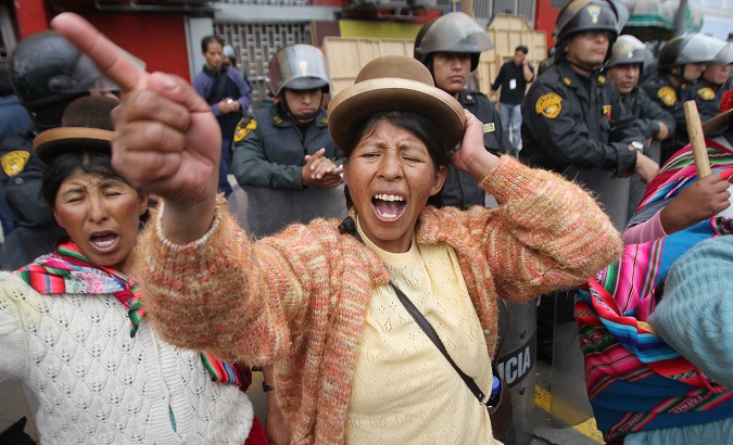 A woman protests the arrest of Walter Aduviri, one of the leaders criminalized during the Aymarazo protest, in Lima, Peru, 2011.