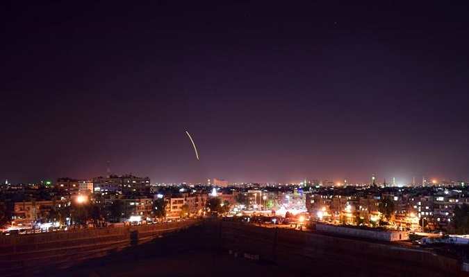 A photo from Syria's Arab News Agency shows a missile over Damascus International Airport, in Syria, 15 September 2018.