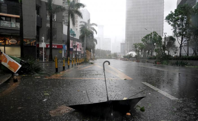 An umbrella is seen on a road after a rainstorm as Typhoon Mangkhut makes landfall in Guangdong province, in Shenzhen, China September 16, 2018