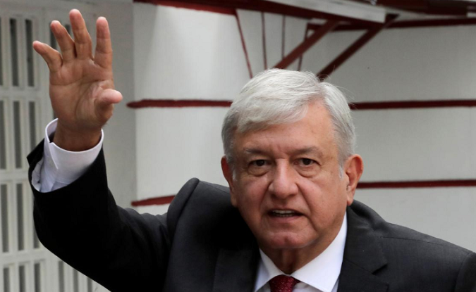 Mexico's President-elect Andres Manuel Lopez Obrador waves while arriving to his campaign headquarters in Mexico City, Mexico September 13, 2018.