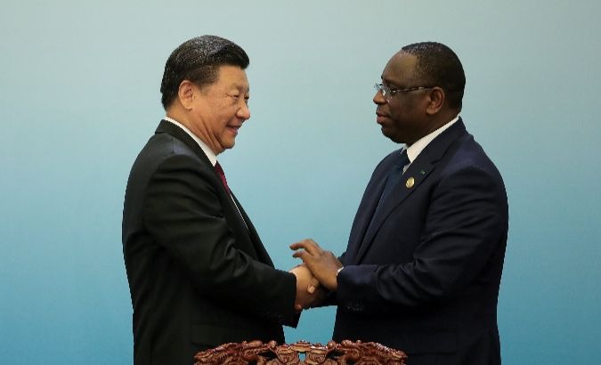 Chinese President Xi shakes hands with Senegal's President Macky Sall in Beijing.