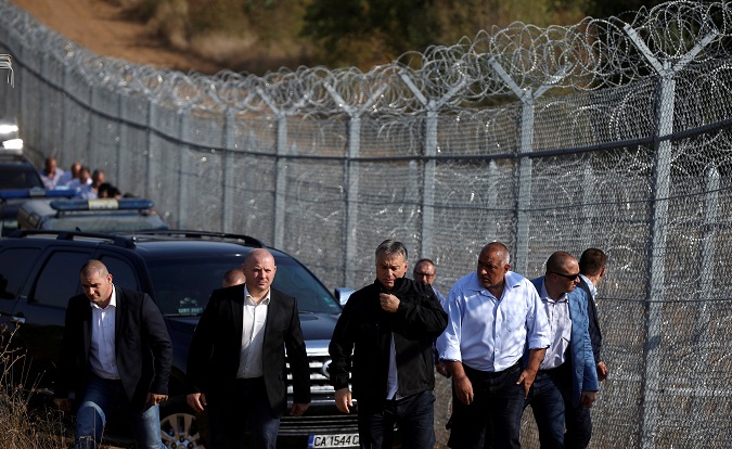 Hungarian Prime Minister Viktor Orban (C) and his Bulgarian counterpart Boiko Borisov (centre R) inspect the barbed wire fence constructed on the Bulgarian-Turkish border, near Lesovo, Bulgaria September 14, 2016.