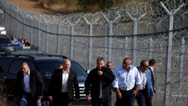 Hungarian Prime Minister Viktor Orban (C) and his Bulgarian counterpart Boiko Borisov (centre R) inspect the barbed wire fence constructed on the Bulgarian-Turkish border, near Lesovo, Bulgaria September 14, 2016.