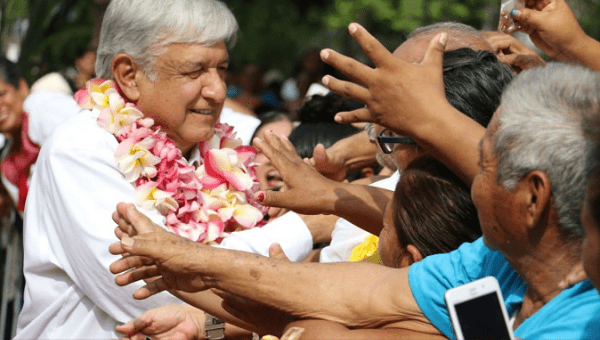 Andres Manuel Lopez Obrador (AMLO) shakes hands with supporters in Sept. 19 visit to Oaxaca.