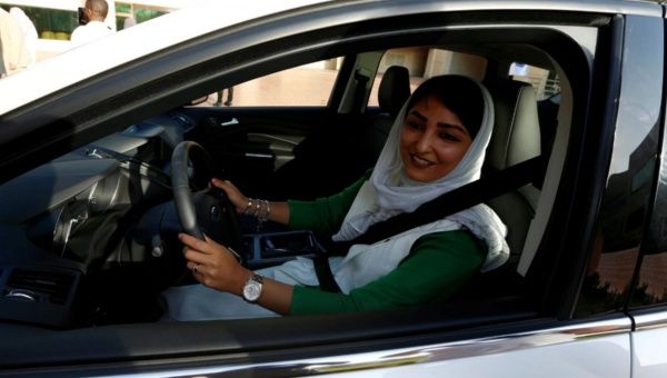 A Saudi woman sits in a car during a driving training at a university in Jeddah, Saudi Arabia.