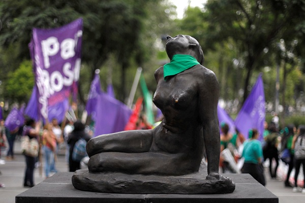 A sculpture in Mexico City wears the green scarf, symbol of the pro-choice movement.