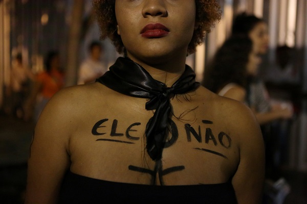 A woman protesting in Rio de Janeiro with 
