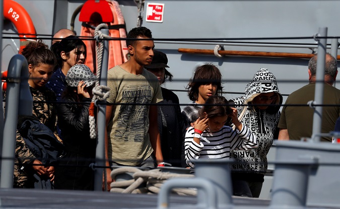 Migrants on a patrol boat after being transferred from the Aquarius, at the Armed Forces of Malta base in Valletta's Marsamxett Harbour, Malta Sept. 30, 2018.