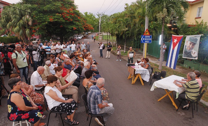 Cubans participate in a debate to discuss the text of the proposed new constitution to vote on in a referendum next year.