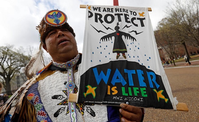 An activist at a protest rally at the White House against the Dakota Access and Keystone XL pipelines in Washington, D.C.