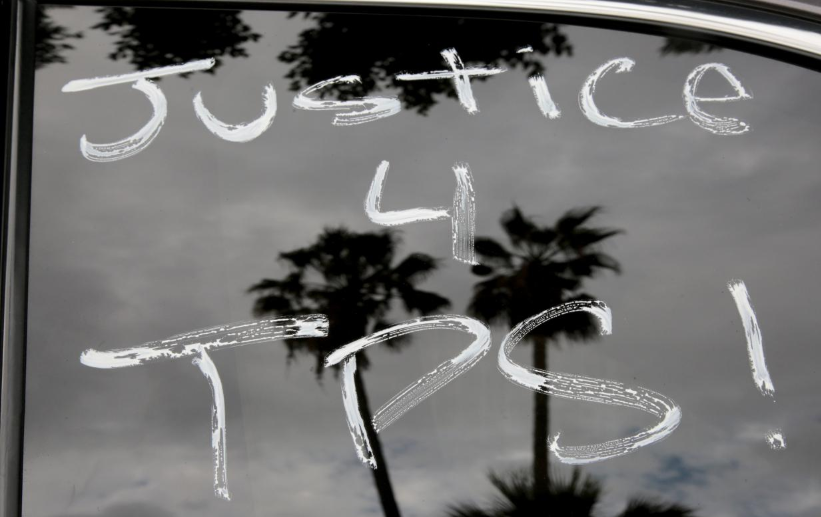 Paint is seen on cars before members of the Teamsters Union participate in a tractor trailer caravan surrounding the LA Metro Detention Center in support of port truck drivers and others threatened by deportation if the courts or congress don't stop the termination of Temporary Protected Status (TPS) in Los Angeles, California, U.S. October 3, 2018.