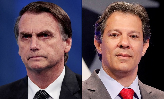 A combination of file photos shows presidential candidate Jair Bolsonaro (L) attending a television debate at the Rede TV studio in Osasco, Brazil August 17, 2018, and presidential candidate Fernando Haddad attending a televised debate in Sao Paulo, Brazil September 26, 2018.