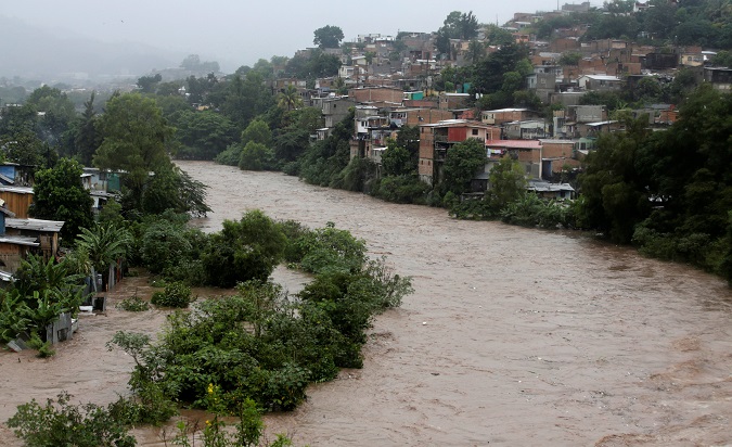 A view of the overflowing Choluteca river after heavy rains in Tegucigalpa, Honduras, Oct. 6, 2018.