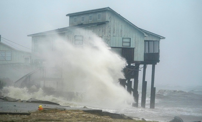 Waves take over a house as Hurricane Michael comes ashore in Alligator Point, Florida, U.S., Oct. 10, 2018.