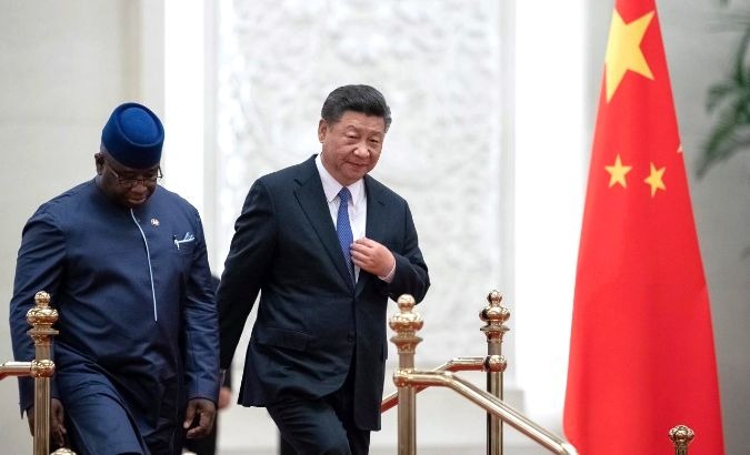 Sierra Leone President Julius Maada Bio (L), seen here with Chinese President Xi Jinping on Aug. 30, 2018, has reassessed several financial commitments.