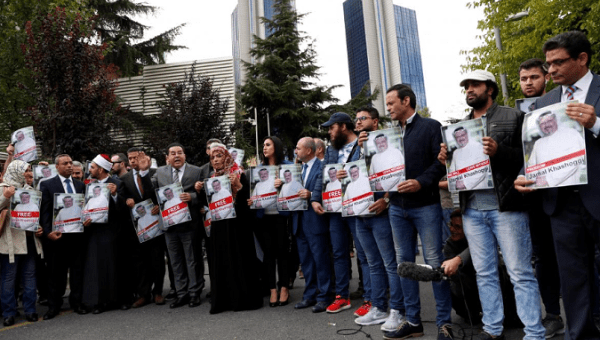  Human rights activists and friends of Saudi journalist Jamal Khashoggi hold his pictures during a protest outside the Saudi Consulate in Istanbul, Turkey Oct. 8, 2018.