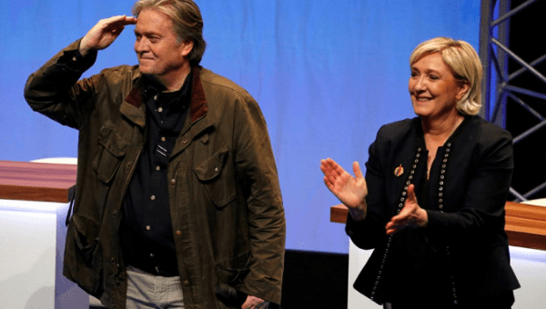 Marine Le Pen, National Front (FN) political party leader, and Former White House Chief Strategist Steve Bannon attend the party's convention in Lille, France, Mar. 10, 2018. 