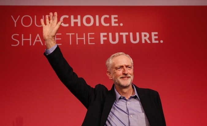 Jeremy Corbyn waves after making his inaugural speech at the Queen Elizabeth Centre in central London, Sept. 12, 2015.
