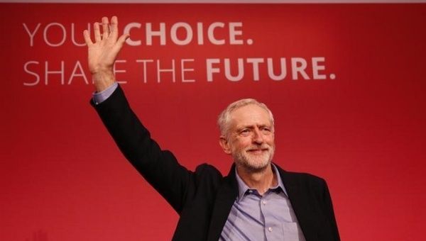 Jeremy Corbyn waves after making his inaugural speech at the Queen Elizabeth Centre in central London, Sept. 12, 2015. 