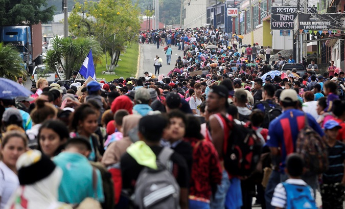 Thousands of Hondurans fleeing poverty and violence move in a caravan toward the United States, in Santa Rosa de Copan, Honduras Oct. 14, 2018