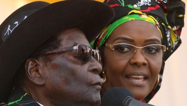 President Robert Mugabe and his wife Grace attend a rally of his ruling ZANU (PF) in Chinhoyi, Zimbabwe Jul. 29, 2017.