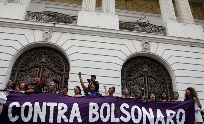 People demonstrate against presidential candidate Jair Bolsonaro in Rio de Janeiro.