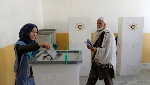 Afghans vote amid chaos, corruption and Taliban threats.