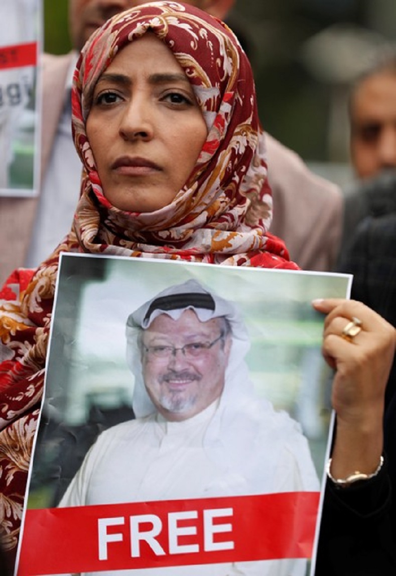 Nobel Peace Prize winner Tawakkol Karman of Yemen holds a picture of Saudi journalist Jamal Khashoggi during a protest outside the Saudi Consulate in Istanbul, Turkey Oct. 8, 2018. 