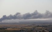 Se ve humo sobre la ciudad siria de Ras al-Ain, en la frontera con Turquía.