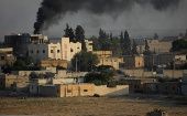 Smoke rises above the Syrian border town of Tel Abyad, as seen from Akcakale, Turkey, October 13, 2019. 
