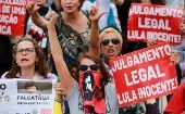 Supporters of former Brazilian President Lula da Silva with placards reading "Legal judgement, Lula innocent" in front of the TRF-4 appeals court in Porto Alegre, Brazil, Nov. 27, 2019. 