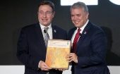 El presidente colombiano Iván Duque (der.) defiende su reforma tributaria como promotora del crecimiento económico.