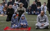 Muslim worshippers take part in the Eid al-Fitr holiday prayer at an outdoor football stadium in Hebron on 24 May.
