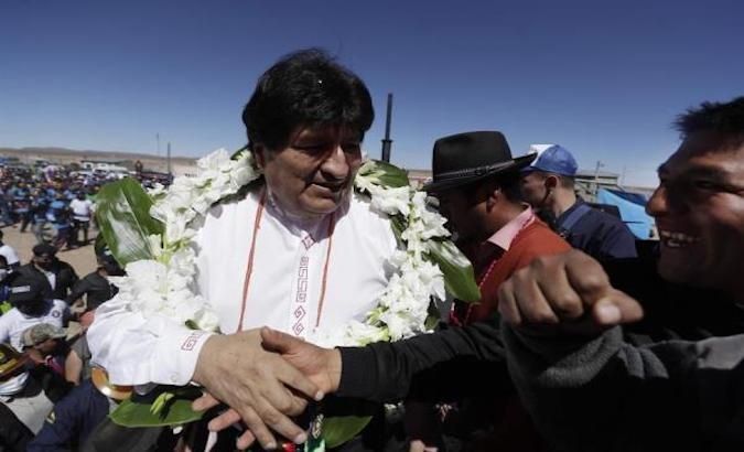 Evo Morales greets his followers in the town of Rio Mulato during the journey of his caravan to Oruro, Bolivia.