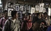 Relatives showing photos of the missing students, Mexico.
