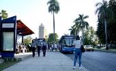 Citizens wait at a bus stop, Havana, Cuba, October 2021.